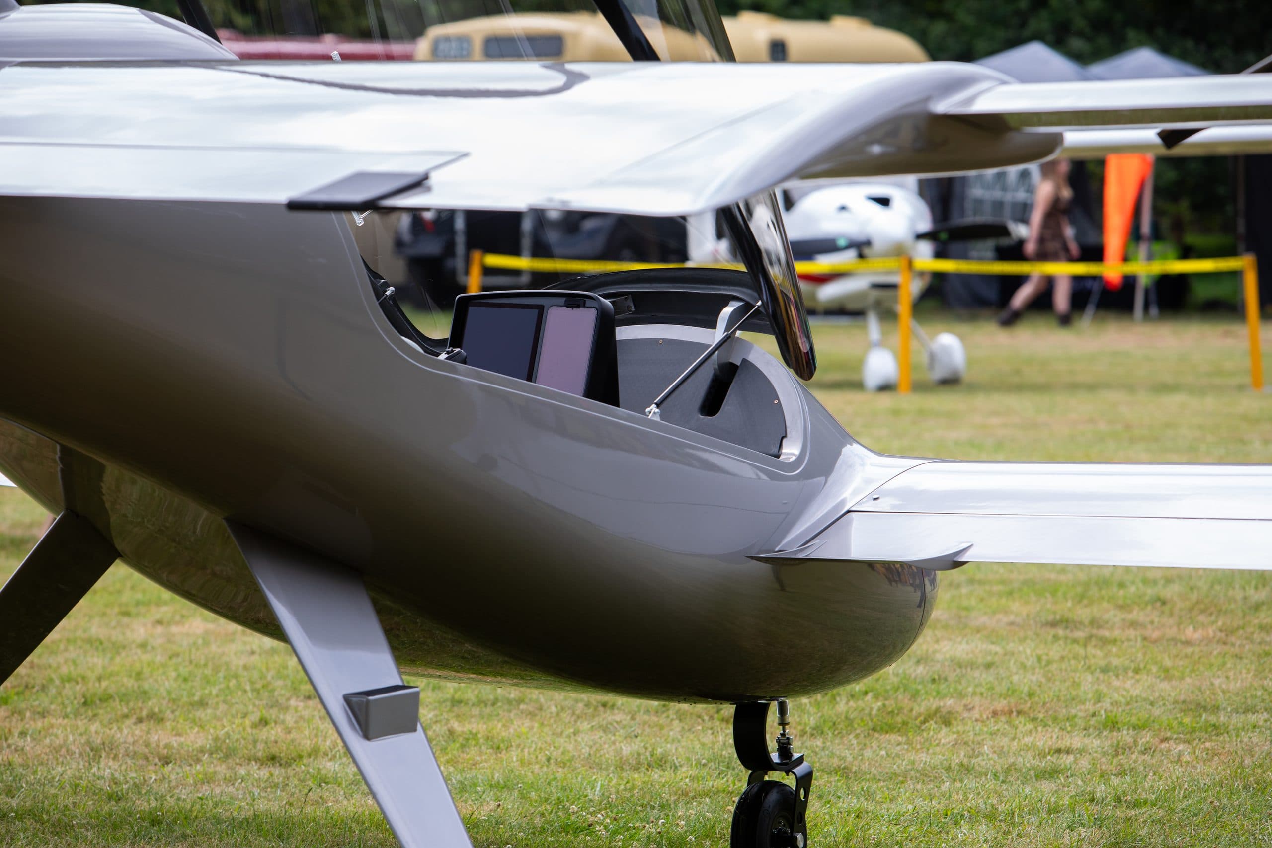 Light aircraft with EFS displays visible in the open cockpit